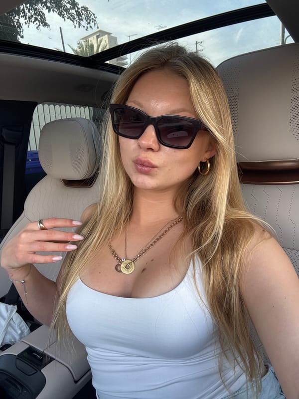 Woman takes car selfie in sunny Netanya