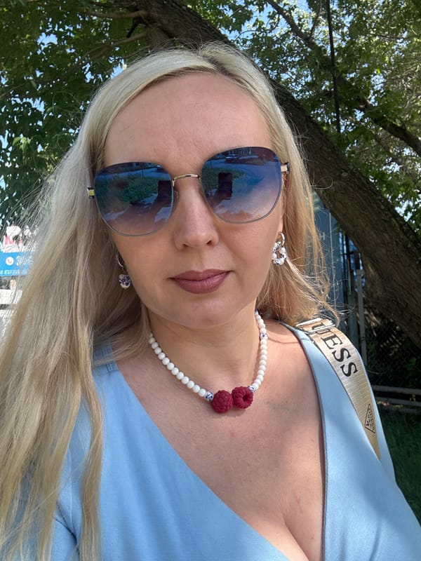 Close-up portrait with raspberry charm necklace in Komsomolsk-on-Amur