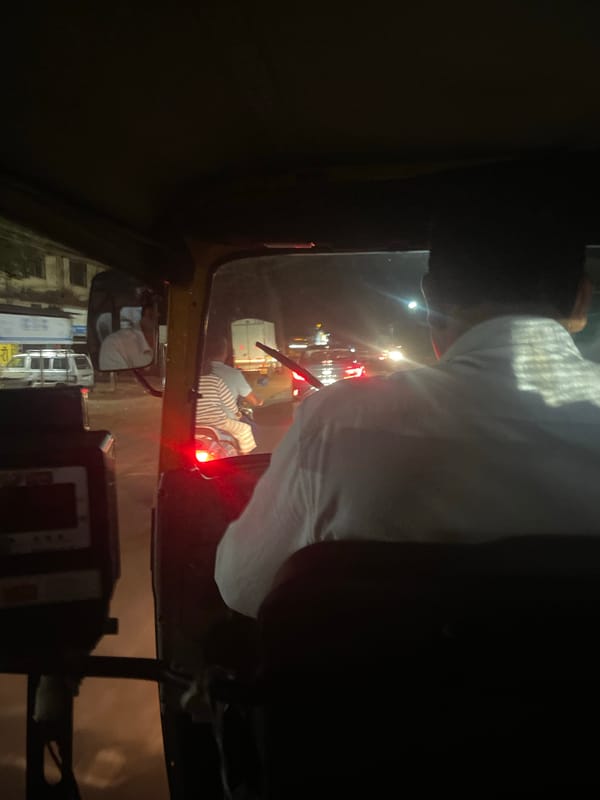 Nighttime auto-rickshaw ride captured in Kudal, India