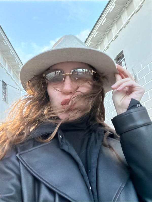 Person photographed outdoors in sunny Moscow afternoon