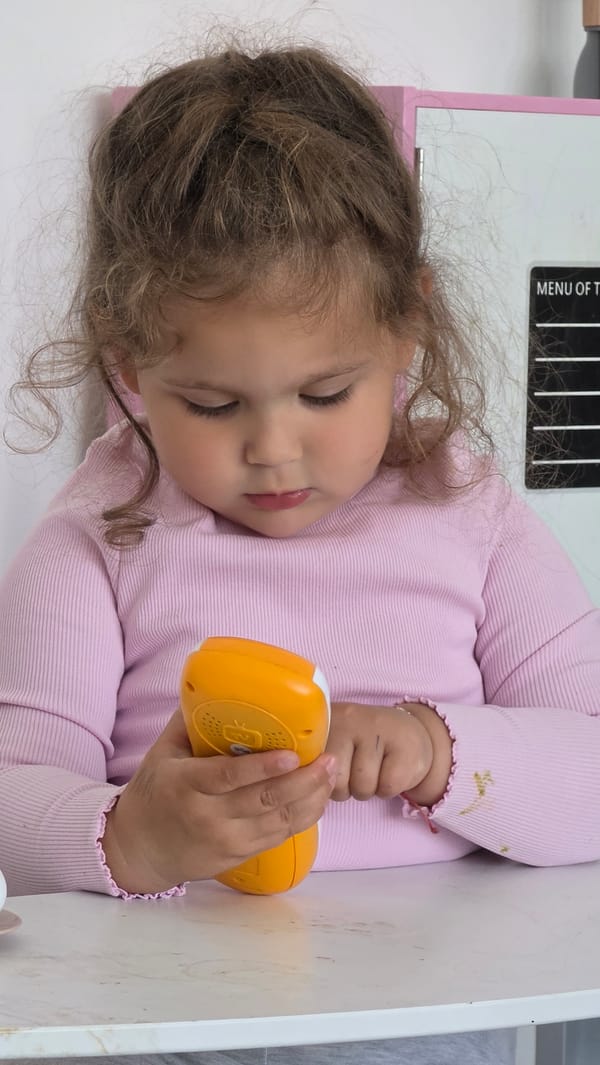 Child rests peacefully on white surface in London