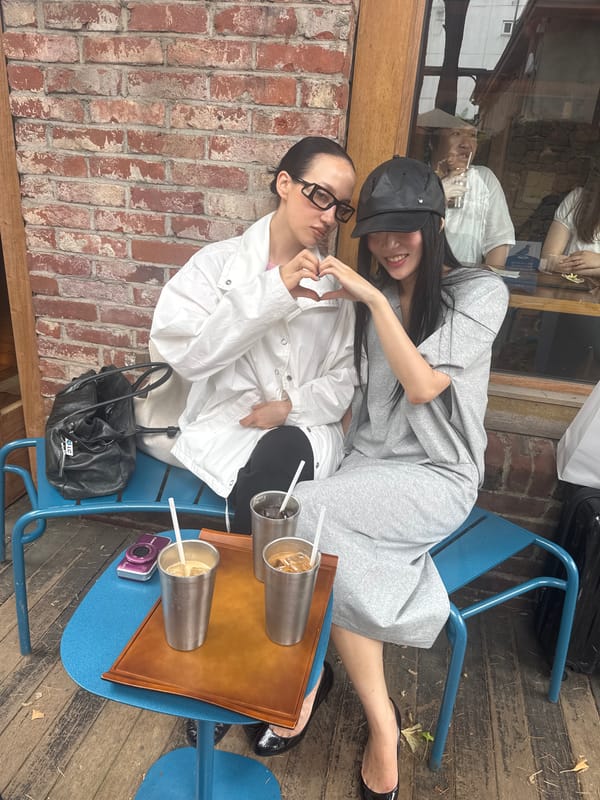 Two women share quiet moment at Seoul cafe