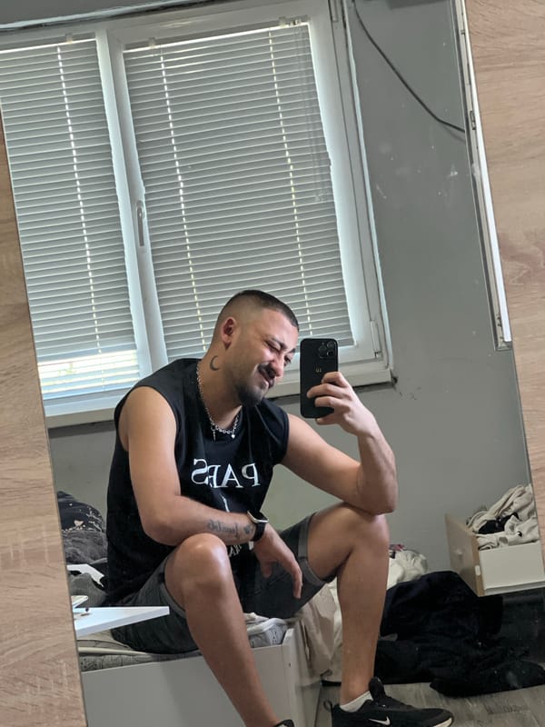 Man takes selfies indoors in Shumata, Bulgaria