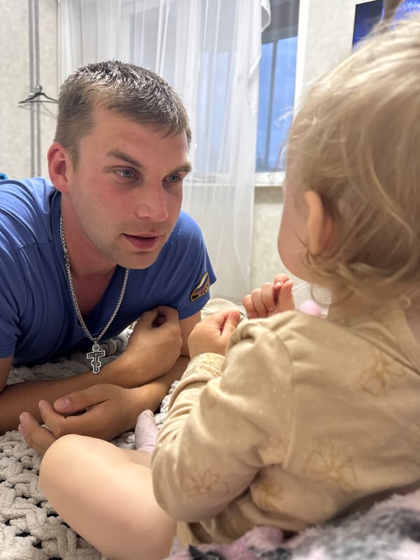 Playful floor time with a baby in Chaikovsky
