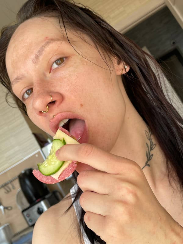 Woman shares sandwich moment with pets in Izhevsk