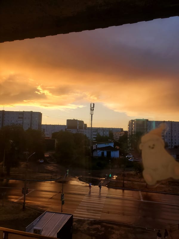 Fiery summer sunset over Sayanogorsk apartment blocks