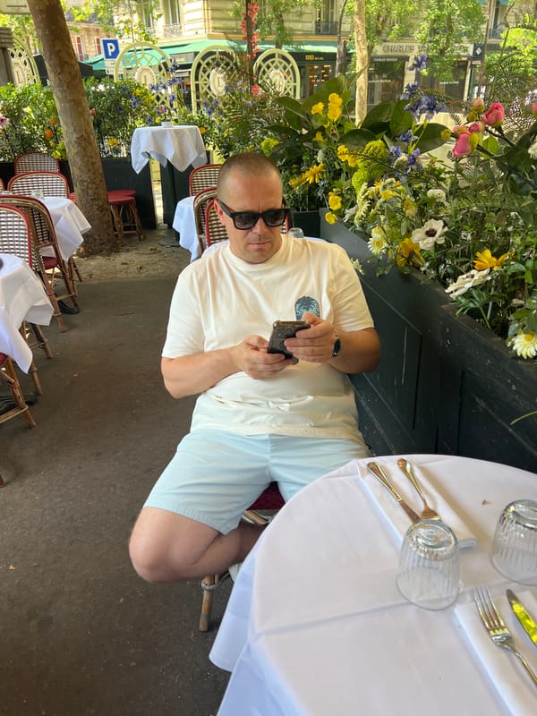 Café morning in Paris: drinks, croissants, and phones