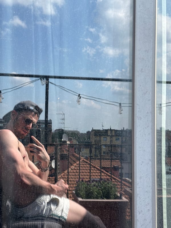Man Takes Selfie in Window Reflection in Milan
