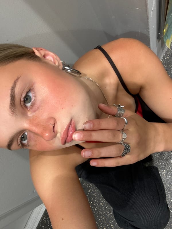 Young person takes selfies indoors in Whistler