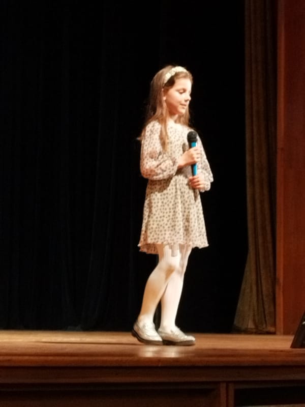Young girl performs on stage in Bansko, Bulgaria