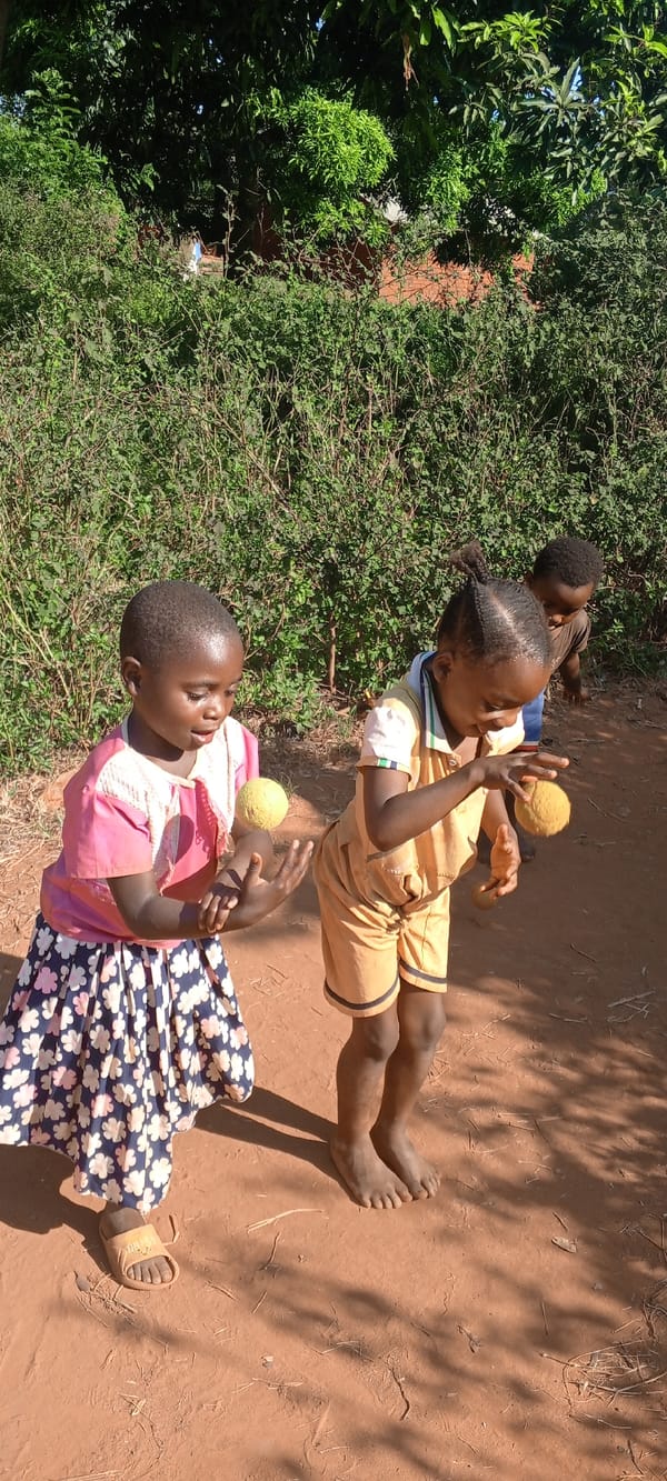 Children play traditional games and music in Ngalula, Congo