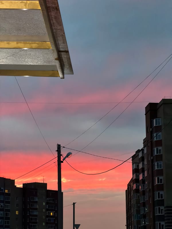 Vivid pink and orange sunset over Froly, Russia