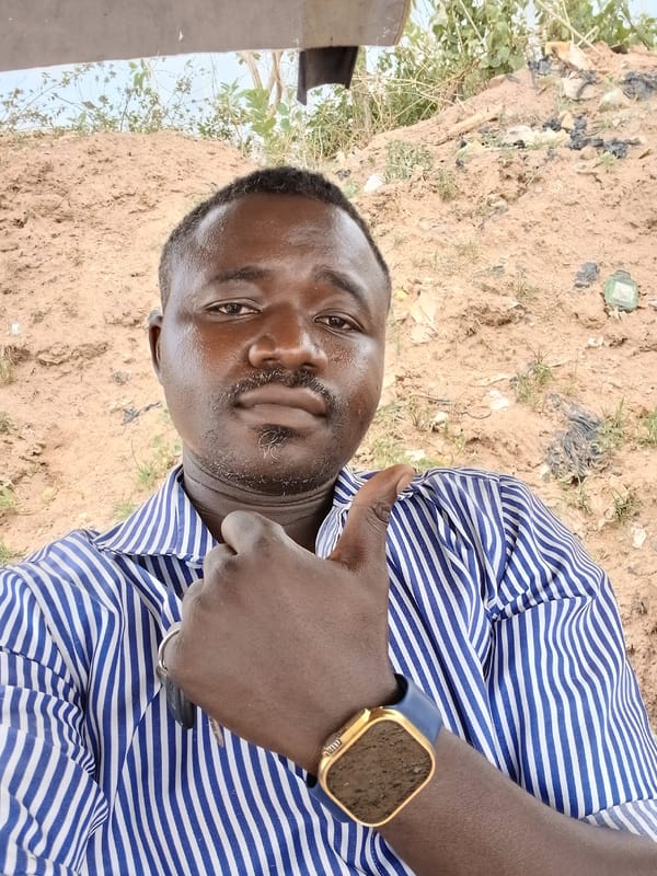 Man in striped shirt observed standing in Abuja