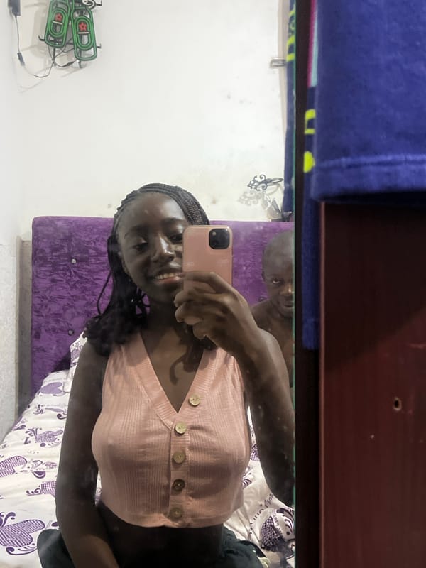 Woman takes morning selfie in Abuja bedroom