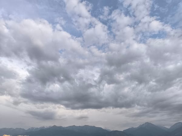 Stormy skies hang over Almaty with the Alatau range in view