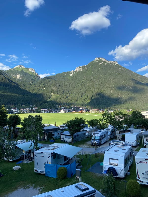 Alpine campsite at Lärchenwiese under clear summer skies