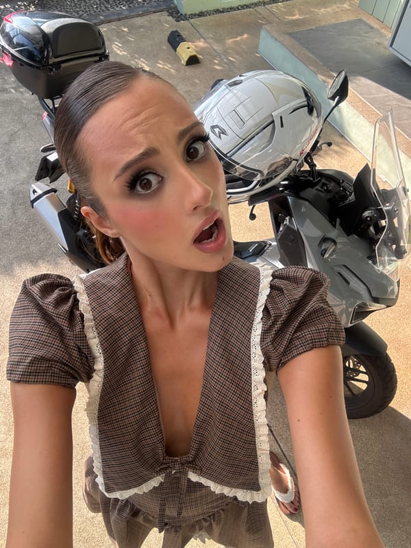 Woman takes excited selfie in Chalong, Thailand