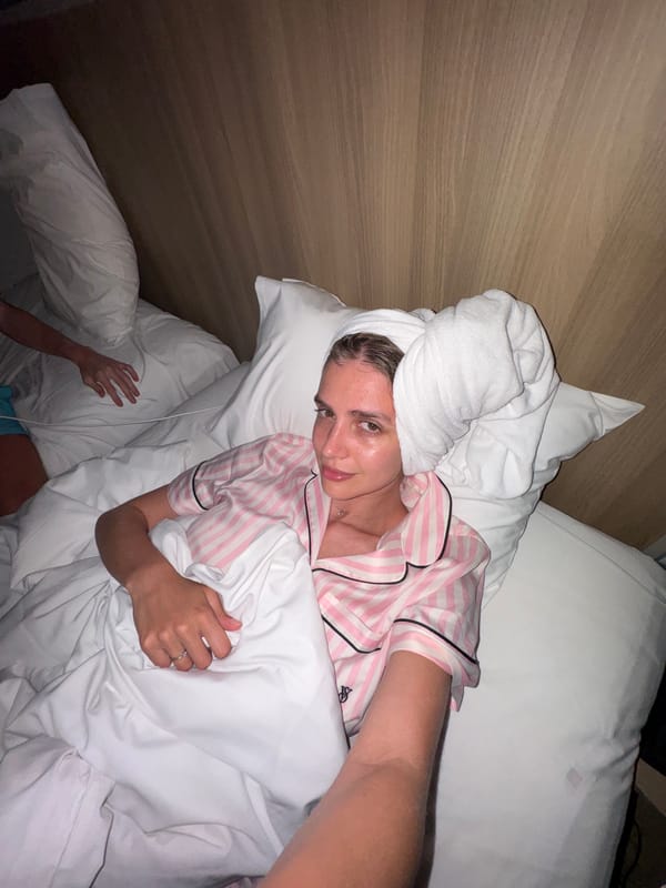 Woman rests in bed with towel, Patong Thailand