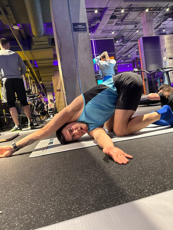 Man exercises on gym floor mat in Kazan