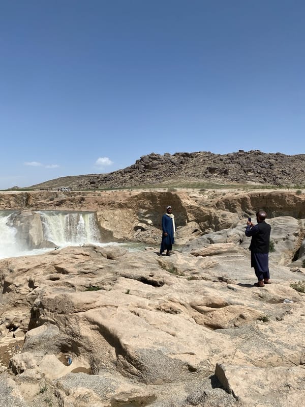 Afghan men document waterfalls at Band-e Amir National Park