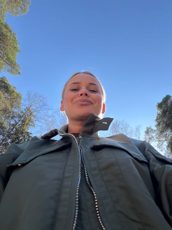 Woman enjoys sunny morning coffee break in Sarapul park