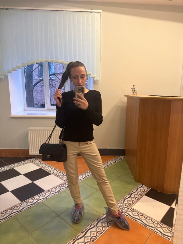 Woman takes mirror selfie indoors in Saint Petersburg