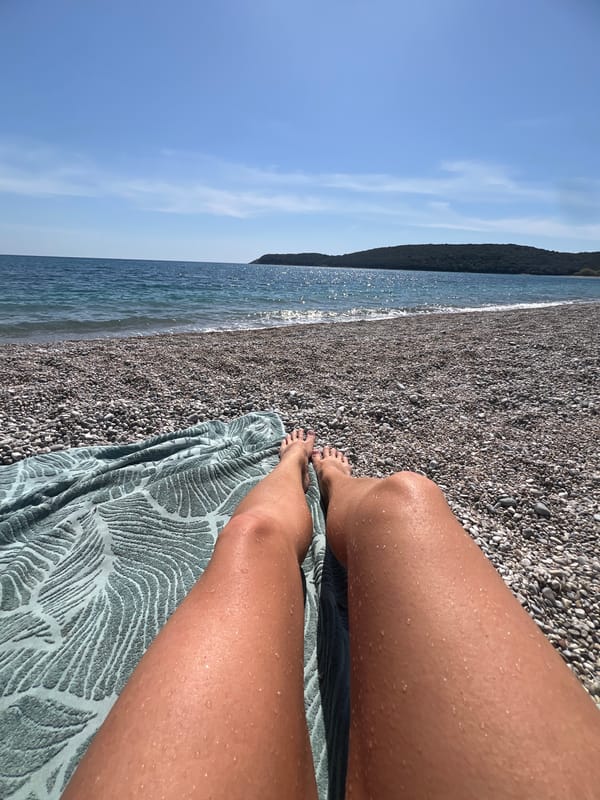 Woman exercises with kettlebells outdoors in Montenegro morning session