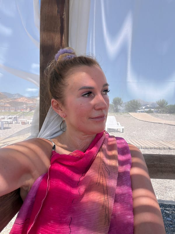 Lazy beach resort morning with sunscreen, selfies, and bougainvillea