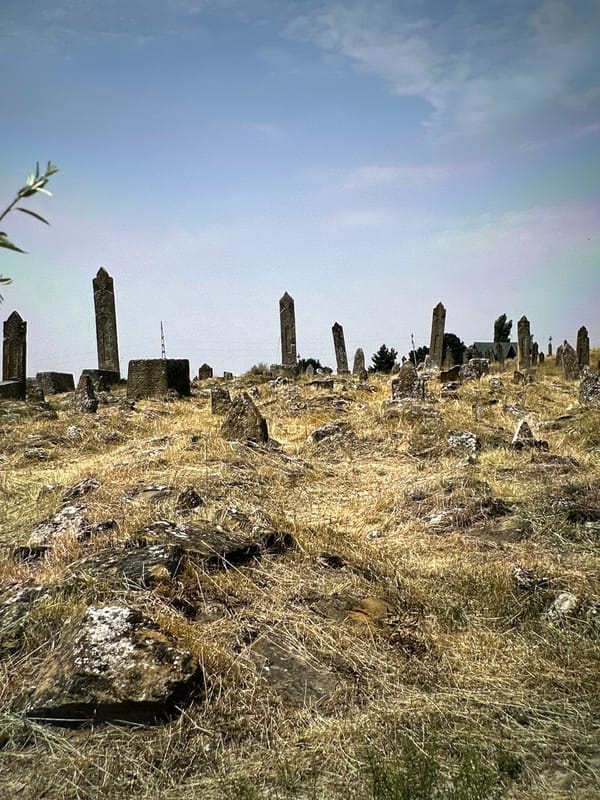 Gobustan's arid hills, ancient graves, and open road