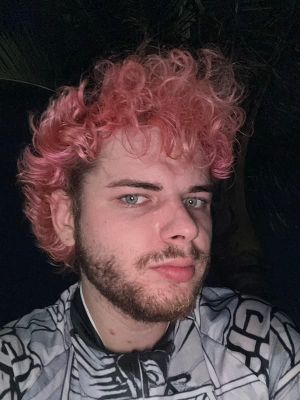 Pink-haired cyclist prepares for night ride along Đà Nẵng coast