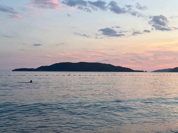Kamenovo Beach at sunset — shoreline, locals, and golden light