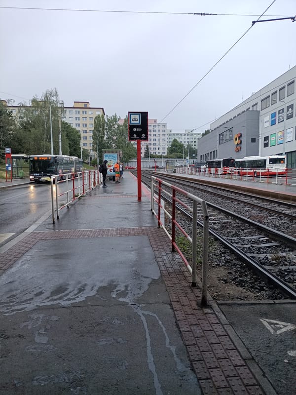 Rainy tram stop selfies near OC Řepy, Prague
