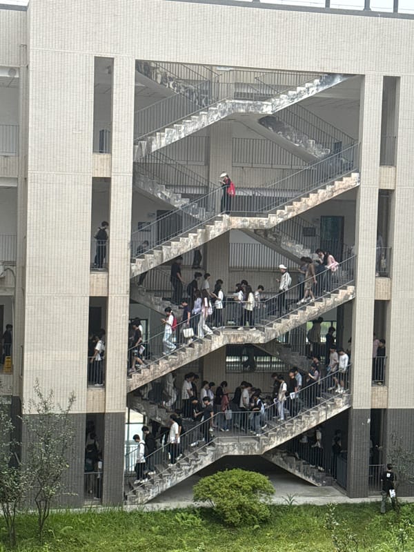 Students crowd outdoor campus walkways in early morning Jiangjin