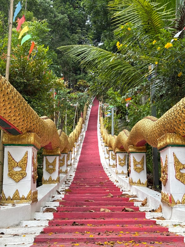 Naga-flanked temple staircase on Koh Phangan