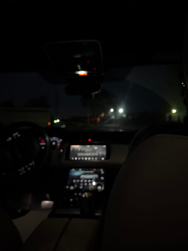 Vehicle interior photographed during nighttime drive in Krasnoyarsk