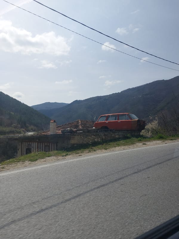 Vintage orange car spotted roadside in Mihalkovo, Bulgaria