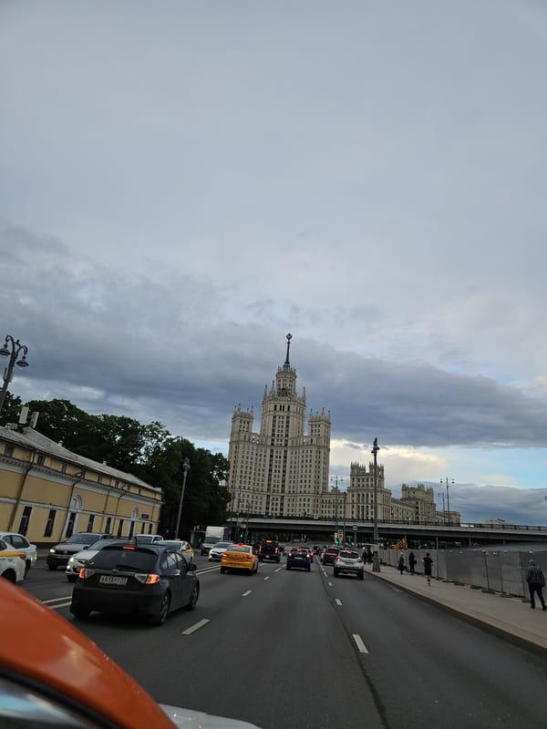 Moscow witnesses document Seven Sisters skyscraper on cloudy afternoon