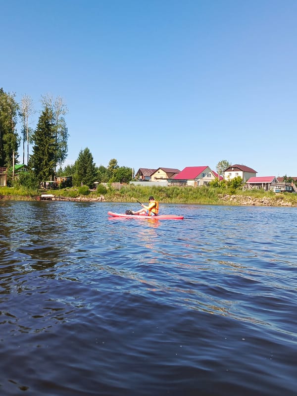 Paddleboard outing on calm water near Chaikovsky, Russia
