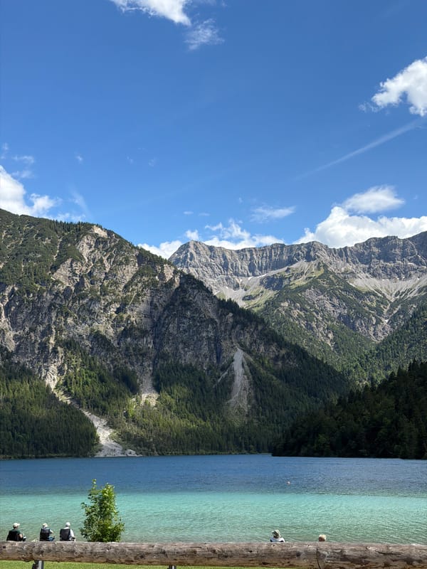 Plansee on a clear Alpine afternoon, boats and mountains