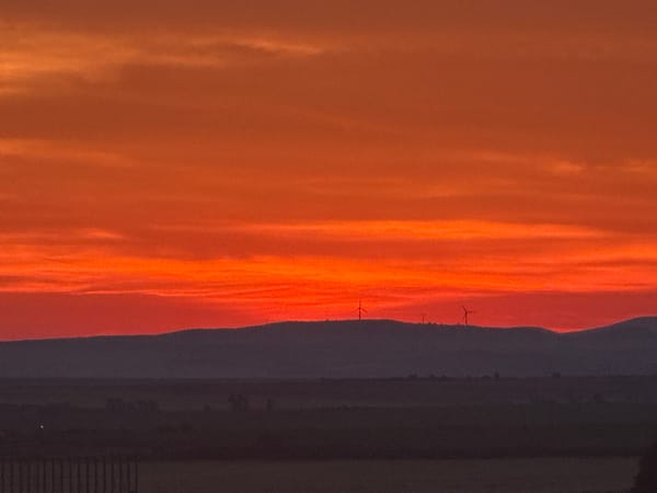 Dramatic sunset illuminates Burgas, Bulgaria industrial landscape