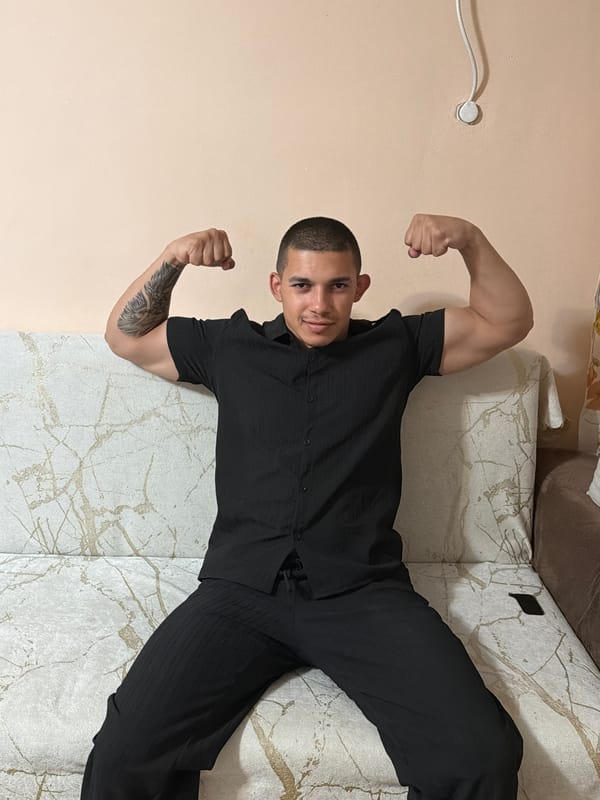 Man poses, flexes in bedroom while drinking energy drinks