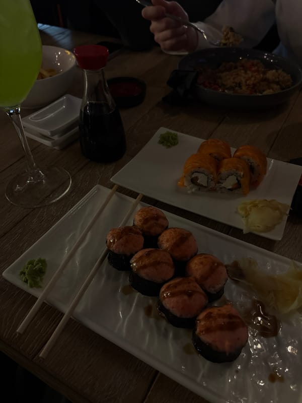 Dinner scene with sushi and rice documented in Russia