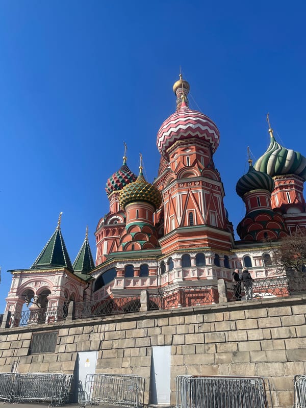 Tourists gather at Moscow's Red Square, Kremlin visible