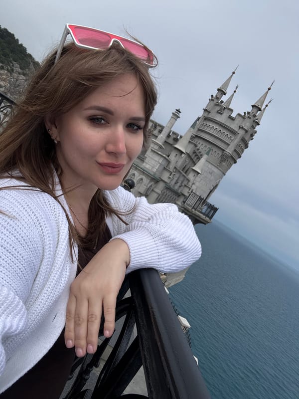 Tourist photographs Swallow's Nest castle and coastal scenery in Ukraine
