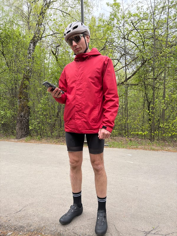 Cyclist group stops on wooded path in Tyumen