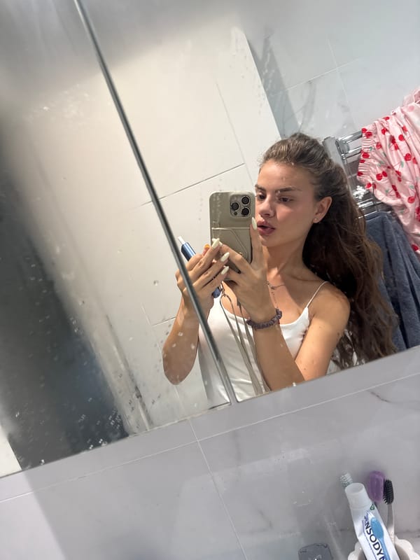 Bathroom mirror selfies in Throop with a vape in hand