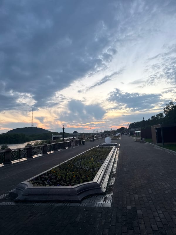 Birobidzhan's riverfront promenade at midsummer dusk