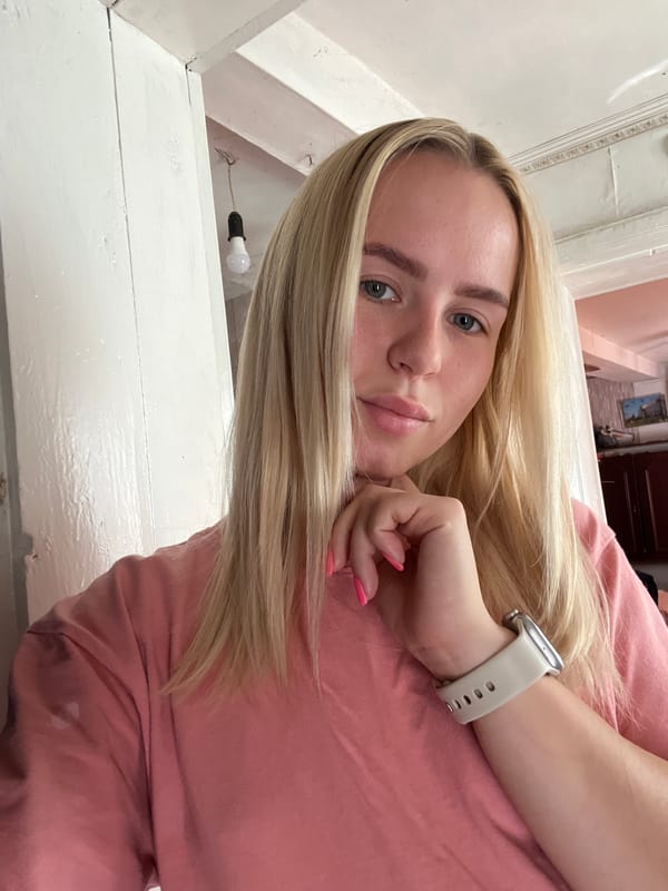 Quick selfie series in an indoor tiled setting, pink shirt throughout