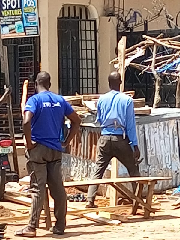 Everyday street and market activity in a West African setting