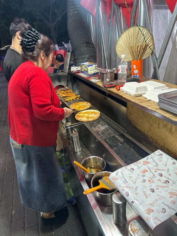 Night food vendor operates stall in Chongqing High-tech Zone